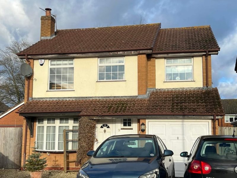 detached house before new fascia, soffits guttering and windows